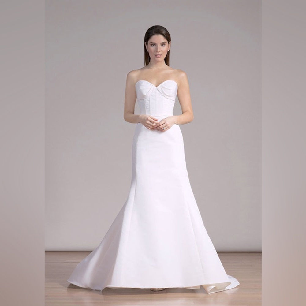 The Liancarlo 6860 is a romantic silk faille strapless mermaid gown.